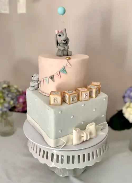 Pastel-decorated baby shower cake
