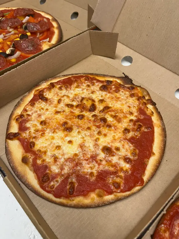 Freshly baked margherita pizza from Belinda's Bakery