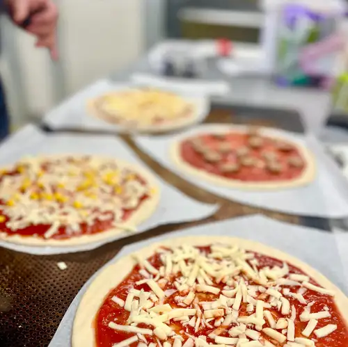Pizza dough being prepared at Belinda's Bakery